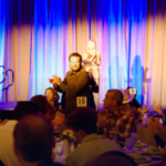 Cole Hauser clapping at Special Operations Warrior Foundation fundraising dinner in Dallas, Texas